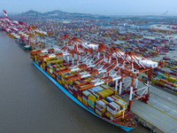 A photo taken in Shanghai, China, on October 18, 2024, shows the operation scene of the Yangshan Deep Water Port area of Shanghai Port. From...