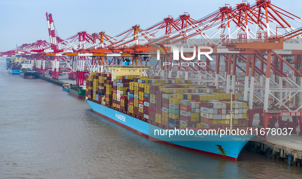 A photo taken in Shanghai, China, on October 18, 2024, shows the operation scene of the Yangshan Deep Water Port area of Shanghai Port. From...