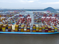 A photo taken in Shanghai, China, on October 18, 2024, shows the operation scene of the Yangshan Deep Water Port area of Shanghai Port. From...