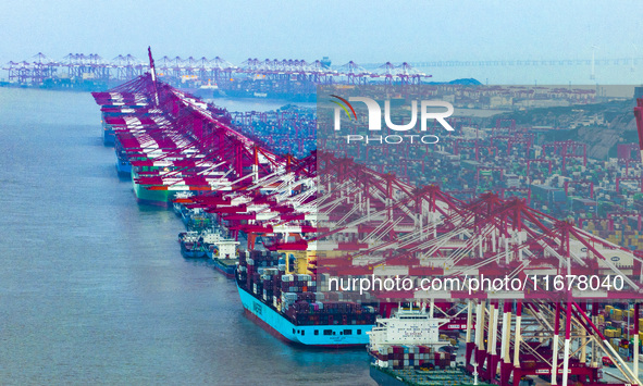 A photo taken in Shanghai, China, on October 18, 2024, shows the operation scene of the Yangshan Deep Water Port area of Shanghai Port. From...