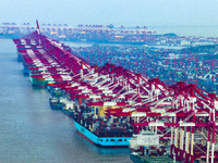 A photo taken in Shanghai, China, on October 18, 2024, shows the operation scene of the Yangshan Deep Water Port area of Shanghai Port. From...