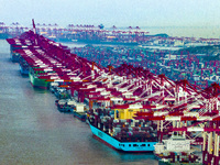 A photo taken in Shanghai, China, on October 18, 2024, shows the operation scene of the Yangshan Deep Water Port area of Shanghai Port. From...