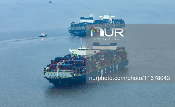 A photo taken in Shanghai, China, on October 18, 2024, shows the operation scene of the Yangshan Deep Water Port area of Shanghai Port. From...