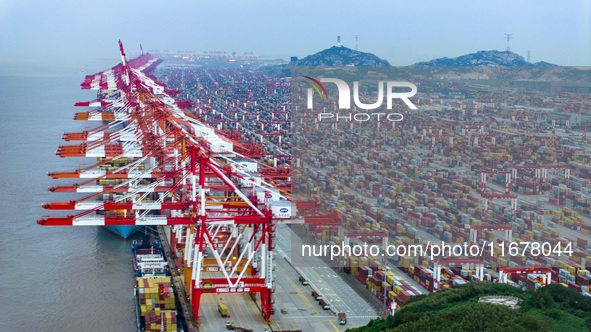 A photo taken in Shanghai, China, on October 18, 2024, shows the operation scene of the Yangshan Deep Water Port area of Shanghai Port. From...