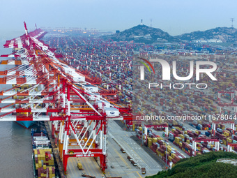 A photo taken in Shanghai, China, on October 18, 2024, shows the operation scene of the Yangshan Deep Water Port area of Shanghai Port. From...