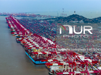 A photo taken in Shanghai, China, on October 18, 2024, shows the operation scene of the Yangshan Deep Water Port area of Shanghai Port. From...