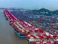 A photo taken in Shanghai, China, on October 18, 2024, shows the operation scene of the Yangshan Deep Water Port area of Shanghai Port. From...