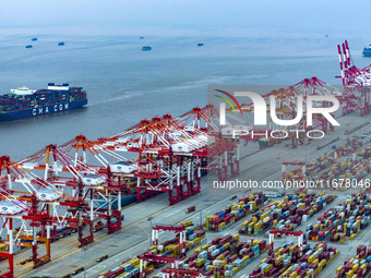 A photo taken in Shanghai, China, on October 18, 2024, shows the operation scene of the Yangshan Deep Water Port area of Shanghai Port. From...