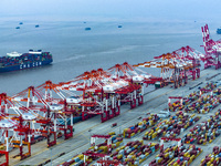 A photo taken in Shanghai, China, on October 18, 2024, shows the operation scene of the Yangshan Deep Water Port area of Shanghai Port. From...