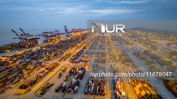 A photo taken in Shanghai, China, on October 18, 2024, shows the operation scene of the Yangshan Deep Water Port area of Shanghai Port. From...