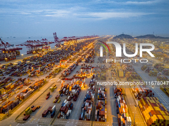 A photo taken in Shanghai, China, on October 18, 2024, shows the operation scene of the Yangshan Deep Water Port area of Shanghai Port. From...