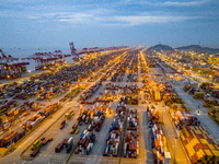 A photo taken in Shanghai, China, on October 18, 2024, shows the operation scene of the Yangshan Deep Water Port area of Shanghai Port. From...