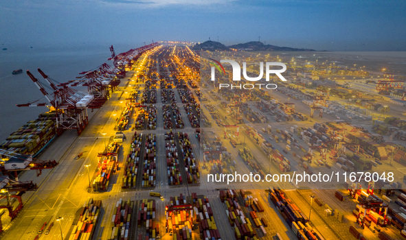 A photo taken in Shanghai, China, on October 18, 2024, shows the operation scene of the Yangshan Deep Water Port area of Shanghai Port. From...