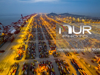 A photo taken in Shanghai, China, on October 18, 2024, shows the operation scene of the Yangshan Deep Water Port area of Shanghai Port. From...