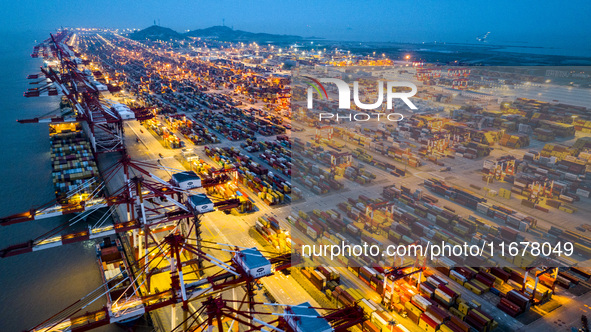 A photo taken in Shanghai, China, on October 18, 2024, shows the operation scene of the Yangshan Deep Water Port area of Shanghai Port. From...