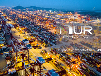 A photo taken in Shanghai, China, on October 18, 2024, shows the operation scene of the Yangshan Deep Water Port area of Shanghai Port. From...