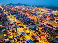 A photo taken in Shanghai, China, on October 18, 2024, shows the operation scene of the Yangshan Deep Water Port area of Shanghai Port. From...