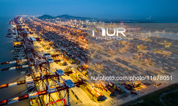 A photo taken in Shanghai, China, on October 18, 2024, shows the operation scene of the Yangshan Deep Water Port area of Shanghai Port. From...