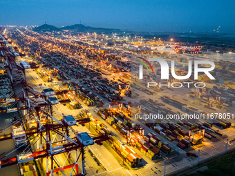 A photo taken in Shanghai, China, on October 18, 2024, shows the operation scene of the Yangshan Deep Water Port area of Shanghai Port. From...