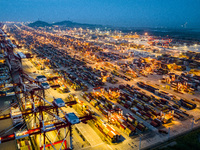 A photo taken in Shanghai, China, on October 18, 2024, shows the operation scene of the Yangshan Deep Water Port area of Shanghai Port. From...