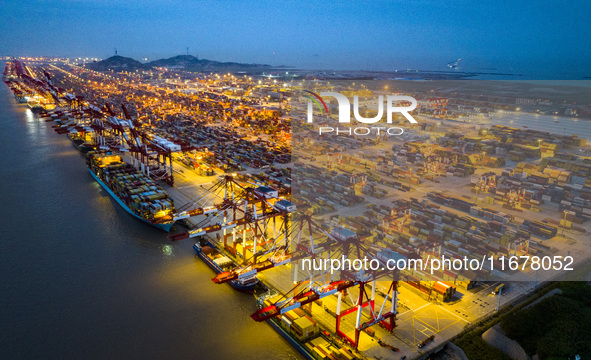 A photo taken in Shanghai, China, on October 18, 2024, shows the operation scene of the Yangshan Deep Water Port area of Shanghai Port. From...