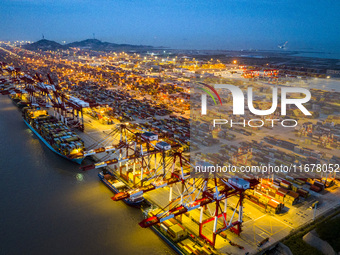 A photo taken in Shanghai, China, on October 18, 2024, shows the operation scene of the Yangshan Deep Water Port area of Shanghai Port. From...