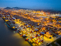 A photo taken in Shanghai, China, on October 18, 2024, shows the operation scene of the Yangshan Deep Water Port area of Shanghai Port. From...