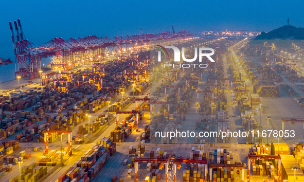 A photo taken in Shanghai, China, on October 18, 2024, shows the operation scene of the Yangshan Deep Water Port area of Shanghai Port. From...