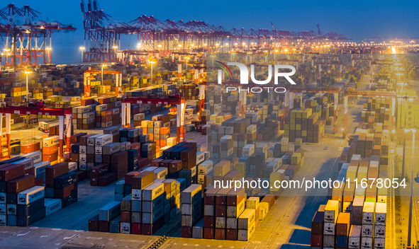 A photo taken in Shanghai, China, on October 18, 2024, shows the operation scene of the Yangshan Deep Water Port area of Shanghai Port. From...