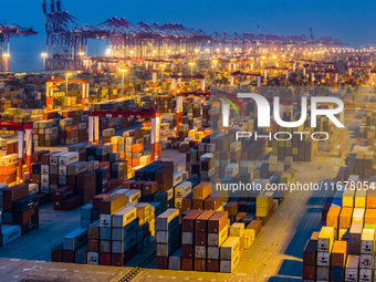 A photo taken in Shanghai, China, on October 18, 2024, shows the operation scene of the Yangshan Deep Water Port area of Shanghai Port. From...