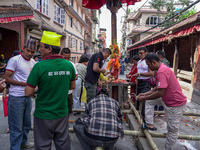 Nepalese Hindu devotees carry the chariot of Lord Satya Narayan during the Hadigaun Jatra festival in Kathmandu, Nepal, on October 18, 2024....