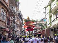 Nepalese Hindu devotees carry the chariot of Lord Satya Narayan during the Hadigaun Jatra festival in Kathmandu, Nepal, on October 18, 2024....