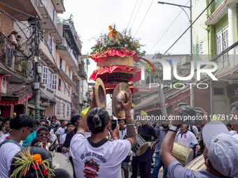 Nepalese Hindu devotees carry the chariot of Lord Satya Narayan during the Hadigaun Jatra festival in Kathmandu, Nepal, on October 18, 2024....