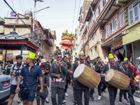 Nepalese Hindu devotees carry the chariot of Lord Satya Narayan during the Hadigaun Jatra festival in Kathmandu, Nepal, on October 18, 2024....