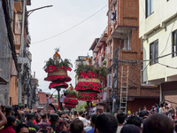 Nepalese Hindu devotees carry the chariot of Lord Satya Narayan during the Hadigaun Jatra festival in Kathmandu, Nepal, on October 18, 2024....