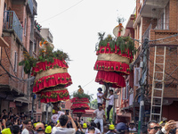 Nepalese Hindu devotees carry the chariot of Lord Satya Narayan during the Hadigaun Jatra festival in Kathmandu, Nepal, on October 18, 2024....