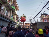 Nepalese Hindu devotees carry the chariot of Lord Satya Narayan during the Hadigaun Jatra festival in Kathmandu, Nepal, on October 18, 2024....