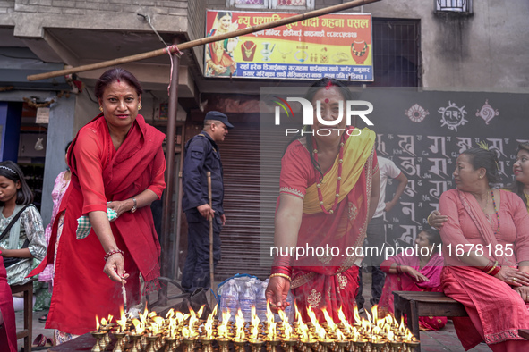 Nepalese Hindu devotees burn oil candles during the Hadigaun Jatra festival in Kathmandu, Nepal, on October 18, 2024. Every year, people acr...