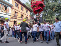 Nepalese Hindu devotees carry the chariot of Lord Satya Narayan during the Hadigaun Jatra festival in Kathmandu, Nepal, on October 18, 2024....