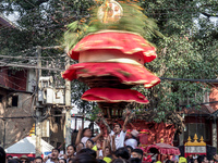 Nepalese Hindu devotees carry the chariot of Lord Satya Narayan during the Hadigaun Jatra festival in Kathmandu, Nepal, on October 18, 2024....