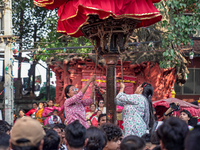 Nepalese Hindu devotees carry the chariot of Lord Satya Narayan during the Hadigaun Jatra festival in Kathmandu, Nepal, on October 18, 2024....