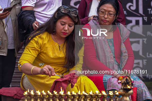 Nepalese Hindu devotees burn oil candles during the Hadigaun Jatra festival in Kathmandu, Nepal, on October 18, 2024. Every year, people acr...