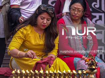 Nepalese Hindu devotees burn oil candles during the Hadigaun Jatra festival in Kathmandu, Nepal, on October 18, 2024. Every year, people acr...