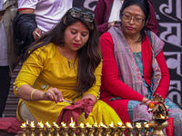 Nepalese Hindu devotees burn oil candles during the Hadigaun Jatra festival in Kathmandu, Nepal, on October 18, 2024. Every year, people acr...