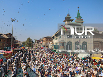 Kashmiri Muslim devotees offer prayers at the shrine of Sufi saint Sheikh Syed Abdul Qadir Jeelani, marking the last Friday of 'urs', or the...