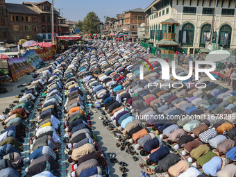 Kashmiri Muslim devotees offer prayers at the shrine of Sufi saint Sheikh Syed Abdul Qadir Jeelani, marking the last Friday of 'urs', or the...