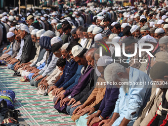 Kashmiri Muslim devotees offer prayers at the shrine of Sufi saint Sheikh Syed Abdul Qadir Jeelani, marking the last Friday of 'urs', or the...