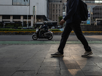 People walk on the pedestrian during rush hour ahead of the presidential inauguration in Jakarta, Indonesia, on October 18, 2024. Prabowo an...