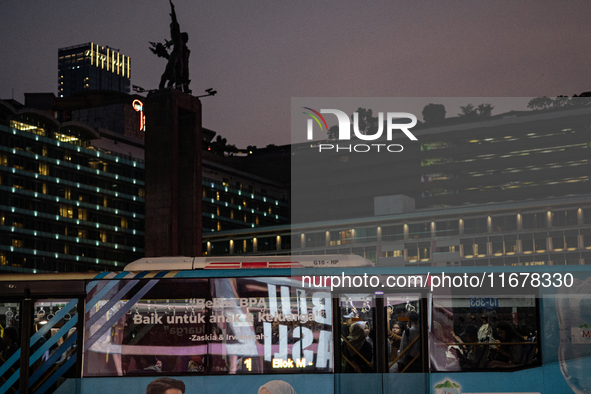 People are inside a bus during rush hour ahead of the presidential inauguration in Jakarta, Indonesia, on October 18, 2024. Prabowo and Gibr...