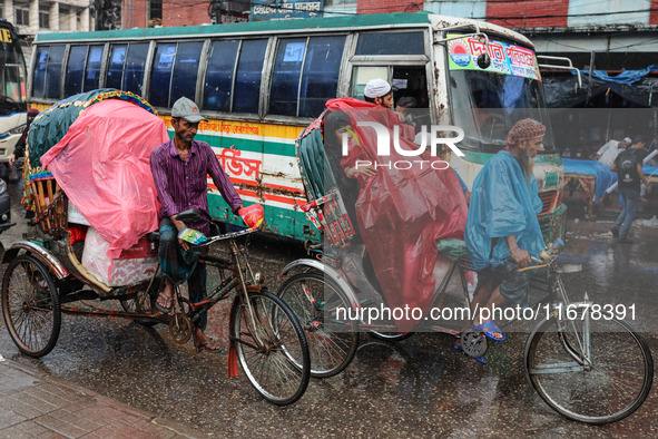 People suffer due to the rain in Dhaka, Bangladesh, on October 18, 2024. 